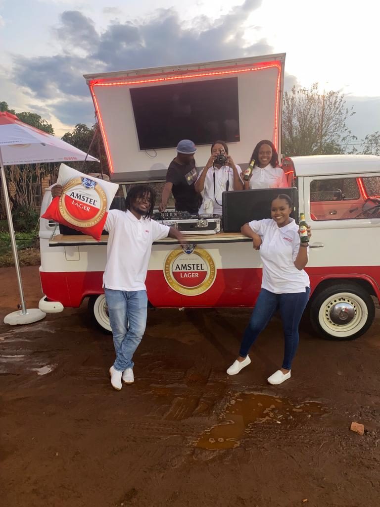 Brand ambassadors at the Amstel Lager branded activation vehicle